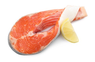 Fresh salmon steak and piece of lemon isolated on white, top view