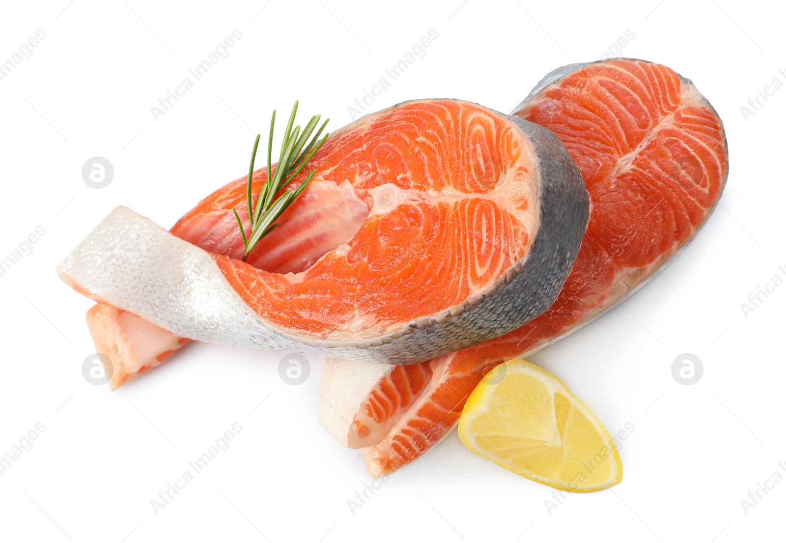 Photo of Two fresh salmon steaks, lemon and rosemary isolated on white, above view