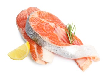 Photo of Two fresh salmon steaks, lemon and rosemary isolated on white