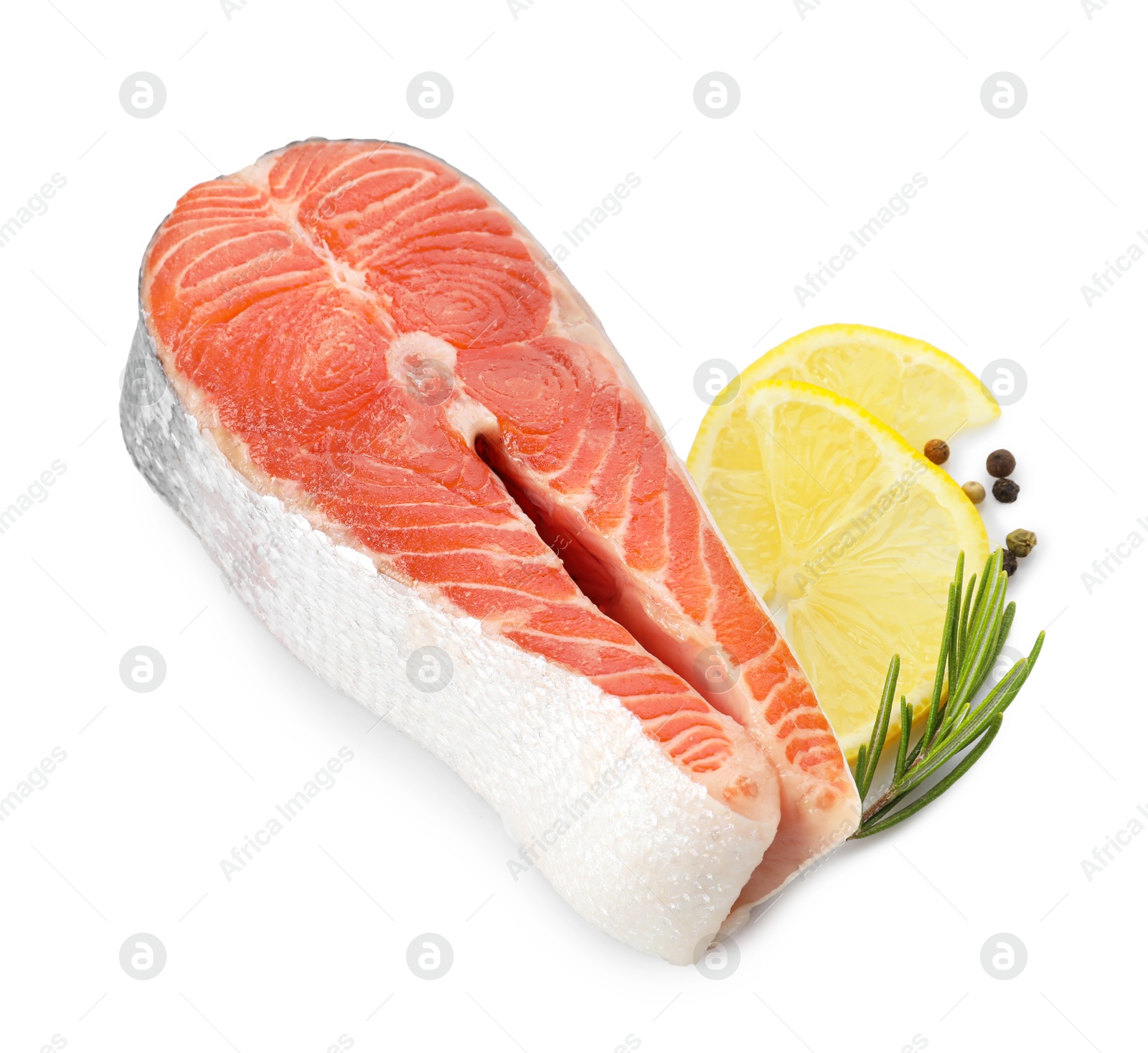 Photo of Fresh salmon steak, lemon, peppercorns and rosemary isolated on white