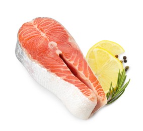 Photo of Fresh salmon steak, lemon, peppercorns and rosemary isolated on white