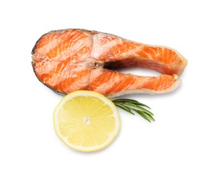 Photo of Tasty grilled salmon steak, lemon and rosemary isolated on white, top view