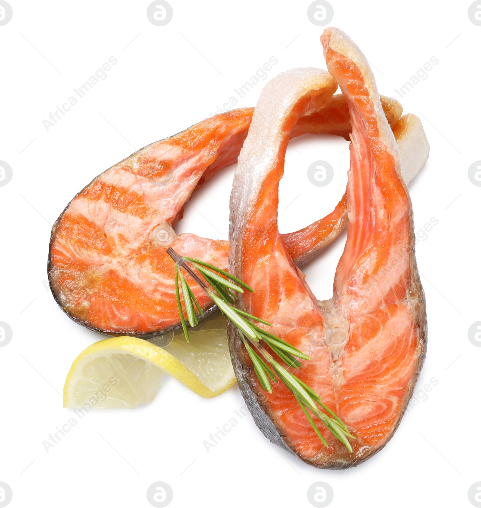 Photo of Tasty grilled salmon steaks and rosemary isolated on white, top view