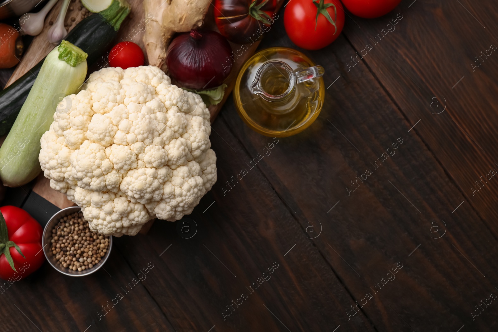 Photo of Different ingredients for stew on wooden table, top view. Space for text