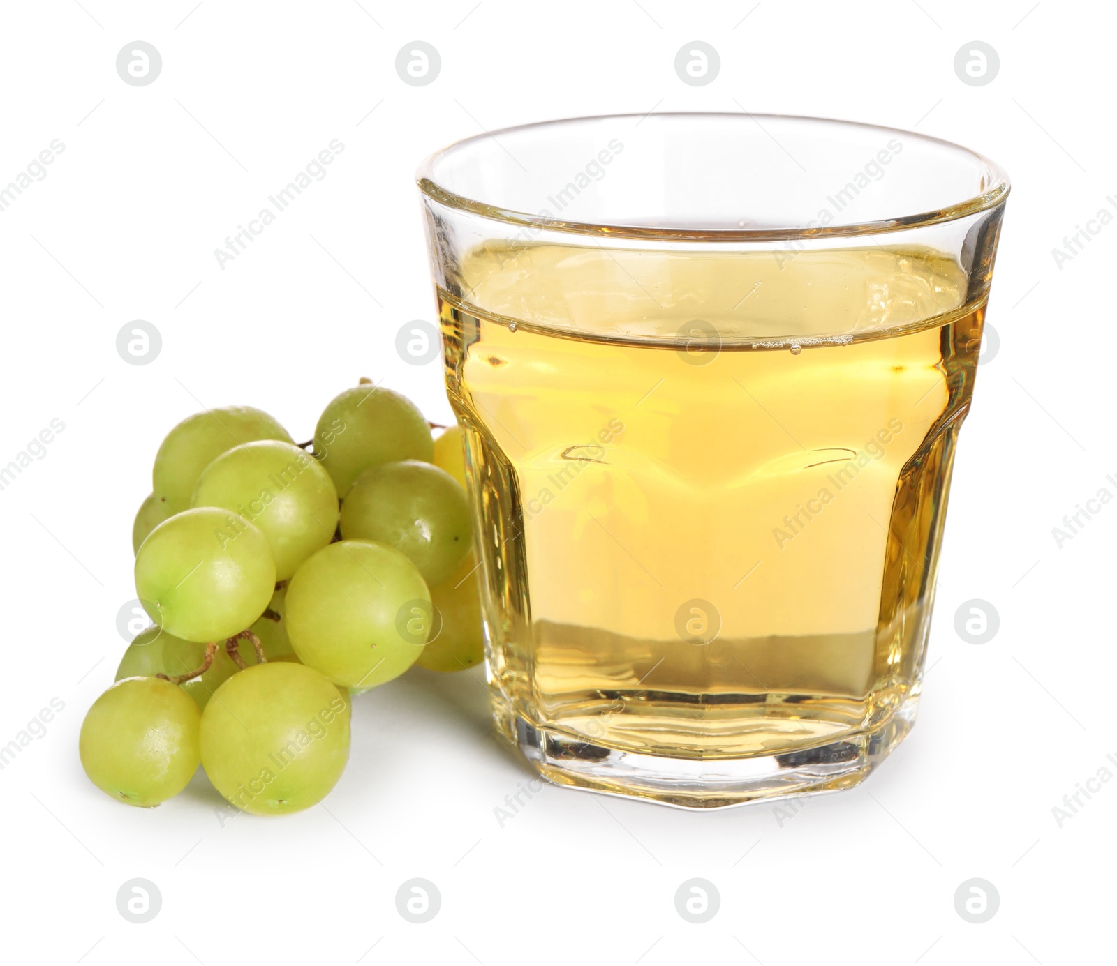 Photo of Ripe grapes and glass of tasty juice isolated on white