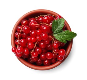 Photo of Ripe red currants with green leaves in bowl isolated on white, top view