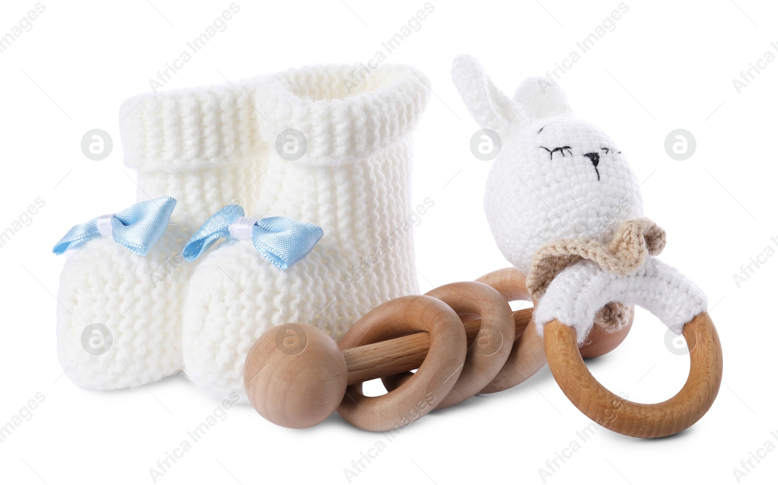 Photo of Baby rattles and booties isolated on white