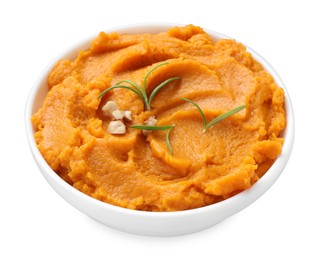 Photo of Delicious mashed sweet potatoes with rosemary and nuts in bowl isolated on white