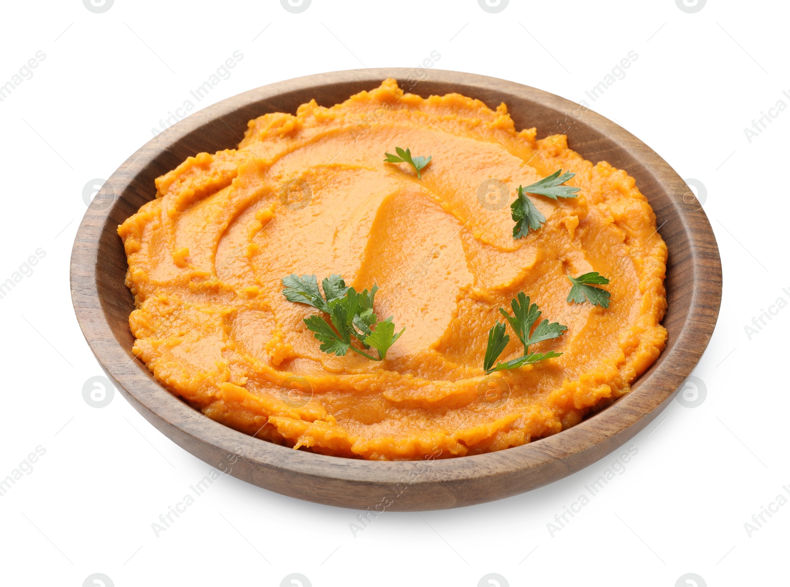 Photo of Delicious mashed sweet potatoes with parsley in bowl isolated on white