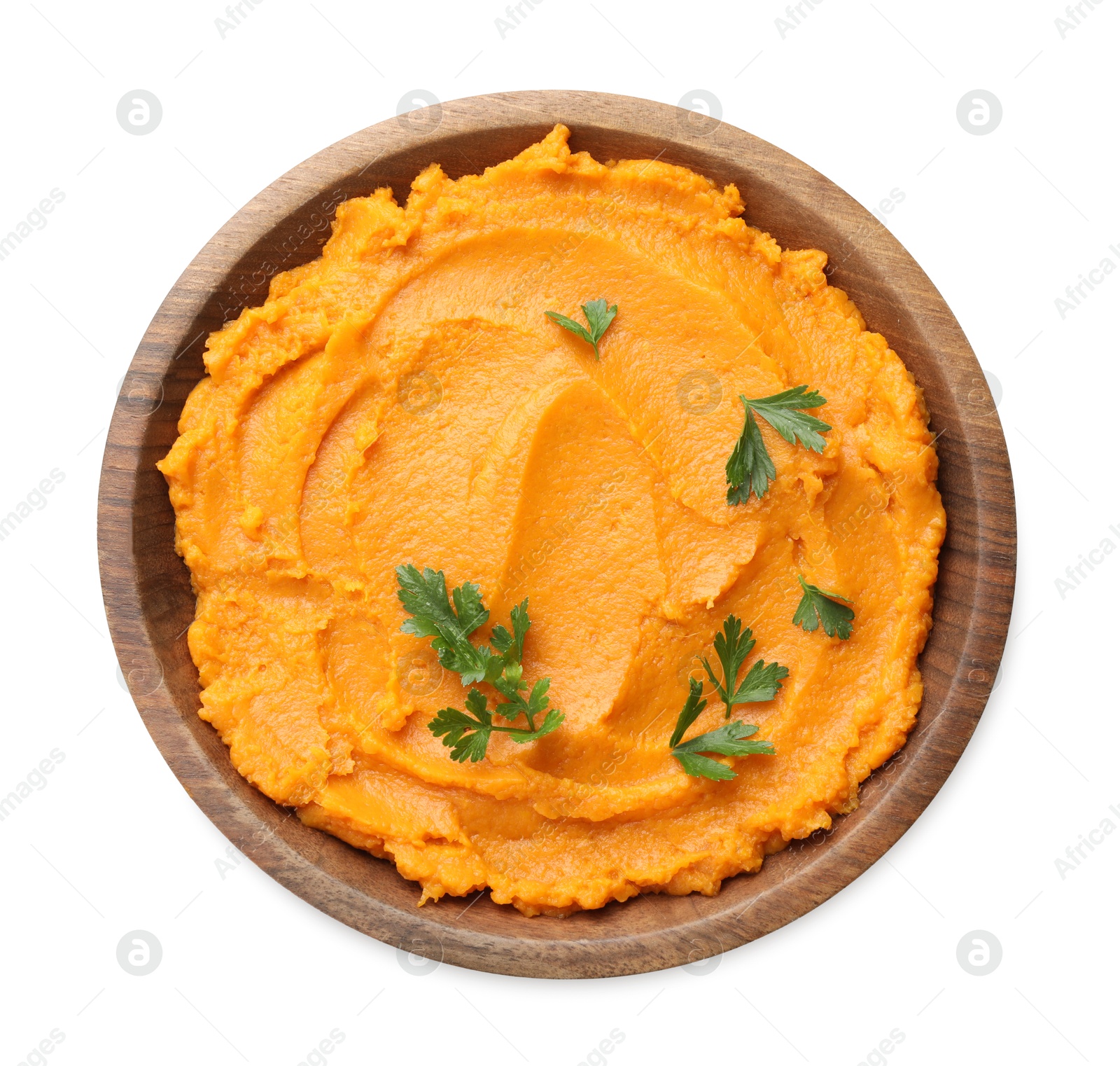 Photo of Delicious mashed sweet potatoes with parsley in bowl isolated on white, top view