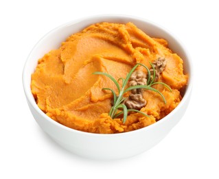 Photo of Delicious mashed sweet potatoes with walnuts and rosemary in bowl isolated on white