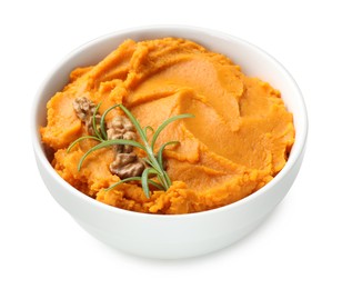 Photo of Delicious mashed sweet potatoes with walnuts and rosemary in bowl isolated on white