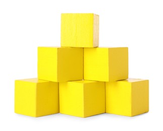 Photo of Many yellow wooden cubes isolated on white