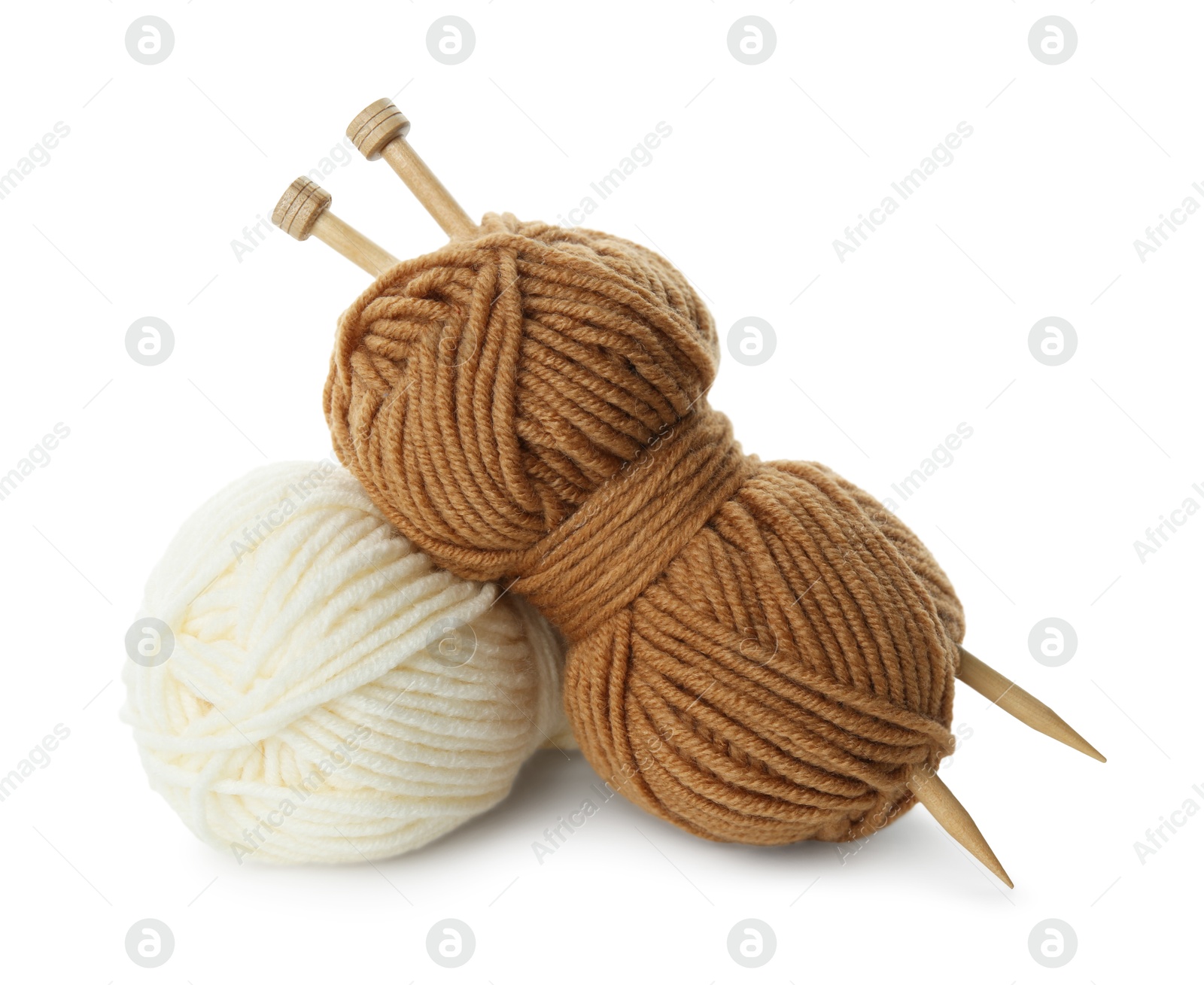 Photo of Skeins of soft yarn and knitting needles isolated on white