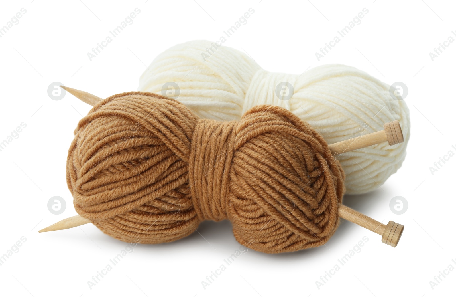 Photo of Skeins of soft yarn and knitting needles isolated on white