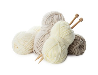 Photo of Skeins of soft yarn and knitting needles isolated on white