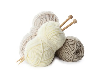 Photo of Skeins of soft yarn and knitting needles isolated on white