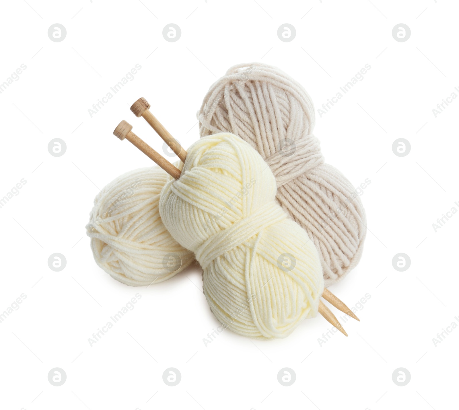 Photo of Skeins of soft yarn and knitting needles isolated on white