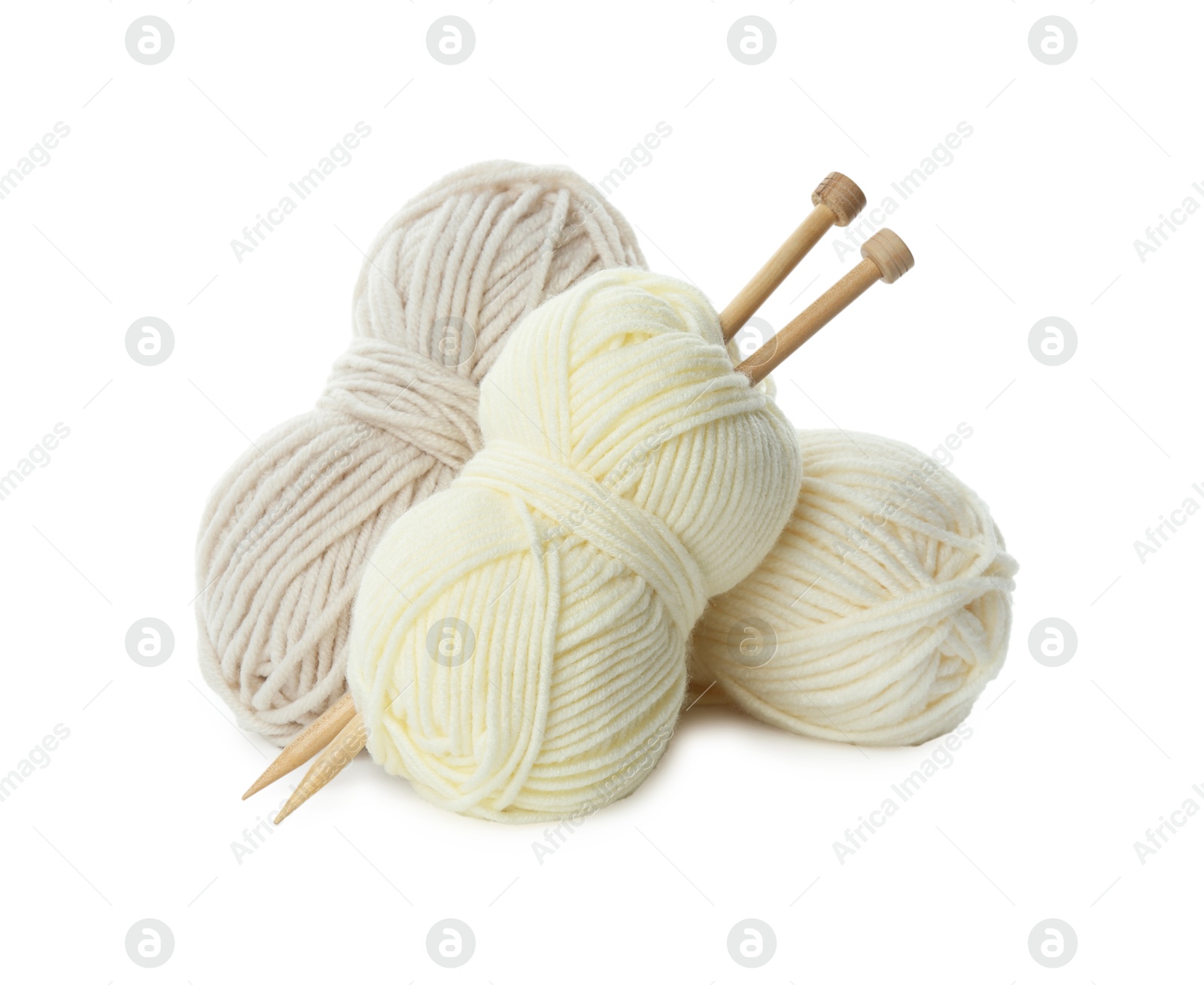 Photo of Skeins of soft yarn and knitting needles isolated on white