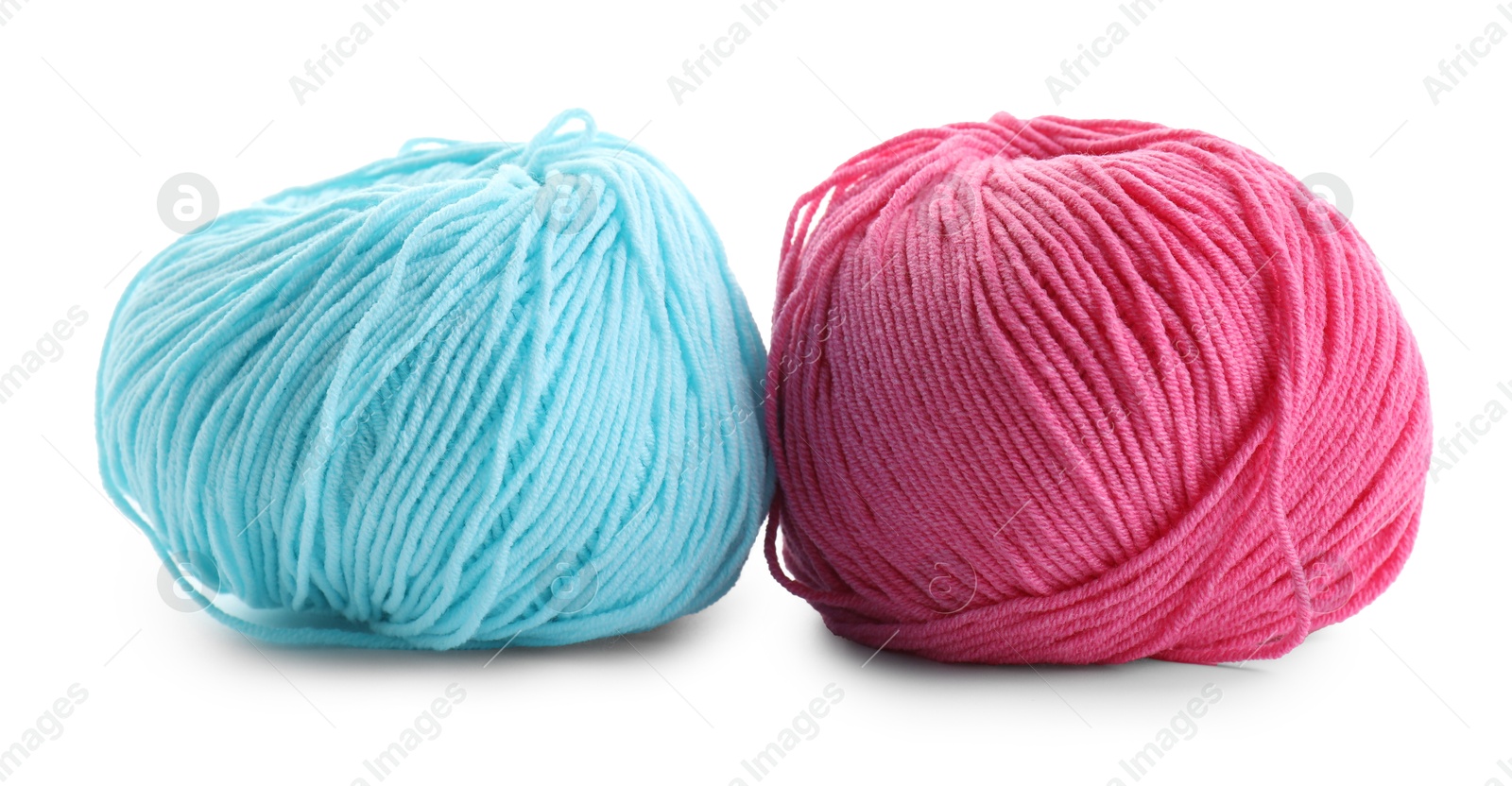 Photo of Pink and light blue yarns isolated on white