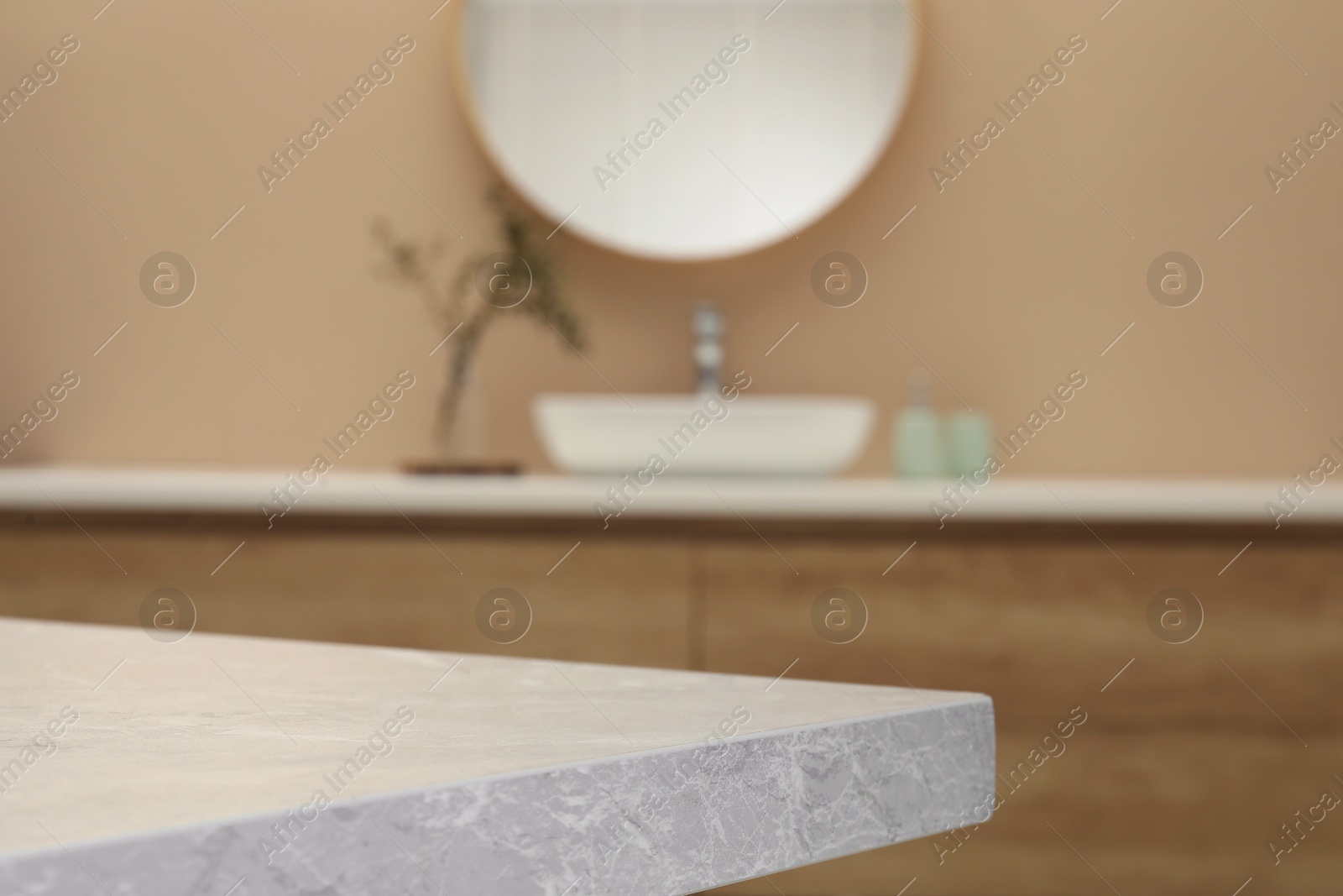 Photo of Empty stone table in bathroom. Space for design