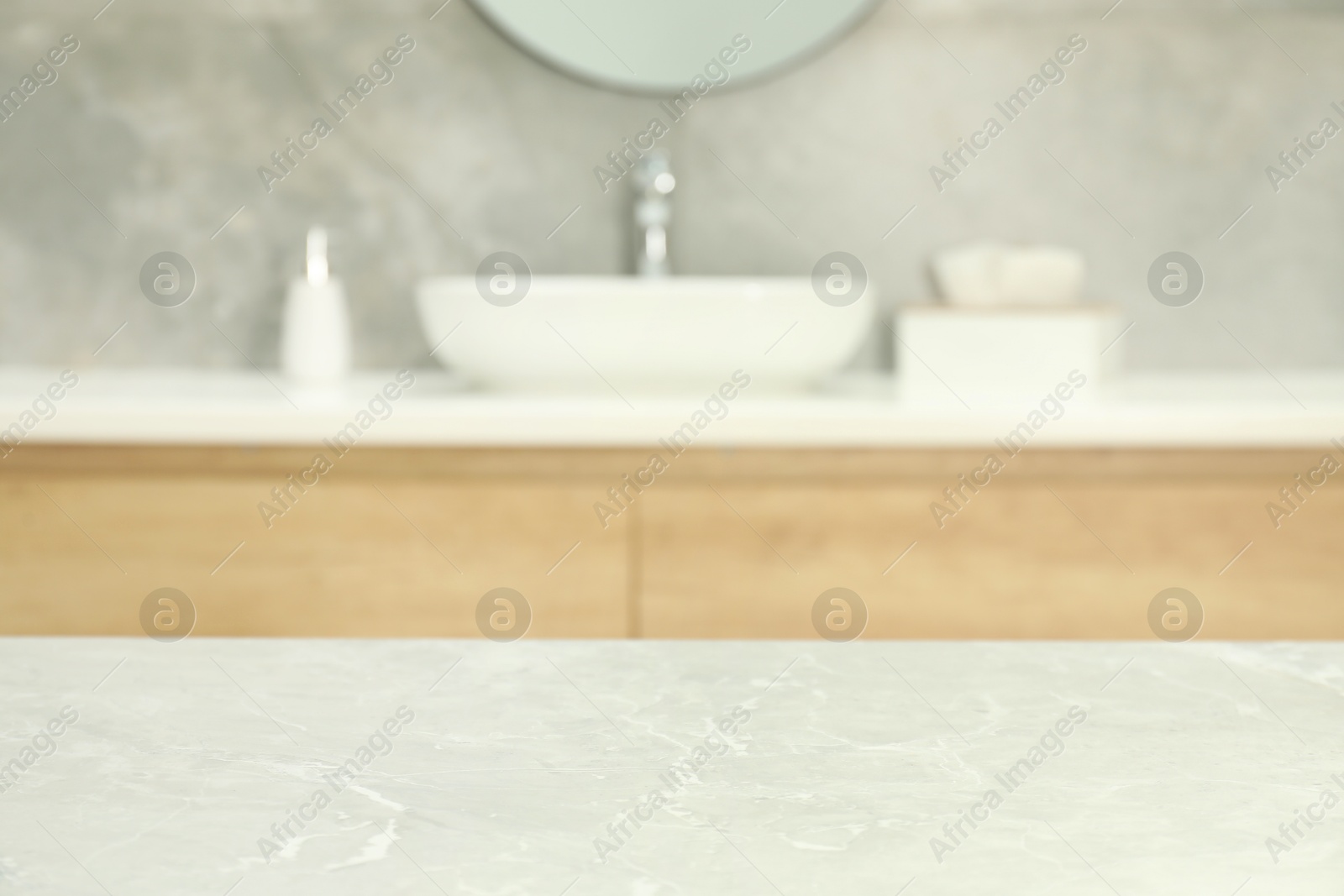 Photo of Empty light grey marble table in bathroom. Space for design