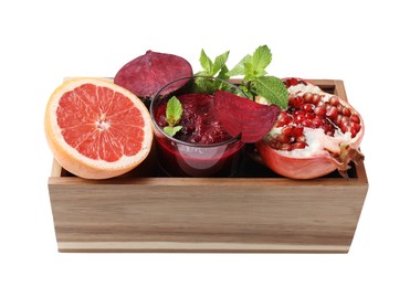 Photo of Glass of tasty beetroot smoothie, fresh vegetables, fruits and mint in wooden box isolated on white. Vegan drink