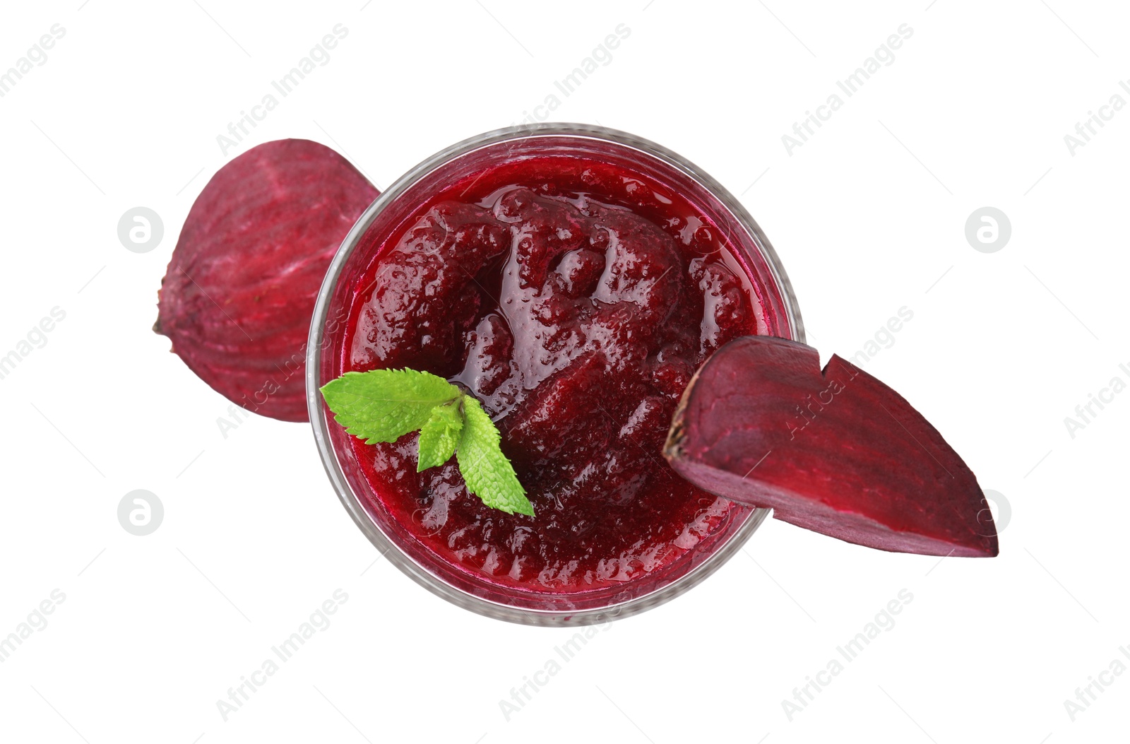 Photo of Tasty beetroot smoothie with mint in glass and pieces of fresh vegetable isolated on white, top view. Vegan drink