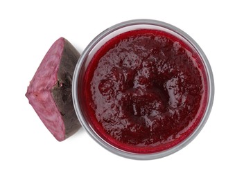 Tasty beetroot smoothie in glass and piece of fresh vegetable isolated on white, top view. Vegan drink