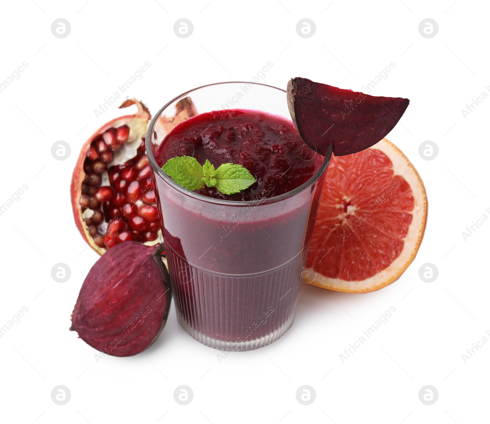 Photo of Tasty beetroot smoothie with mint in glass, fresh vegetables and fruits isolated on white. Vegan drink