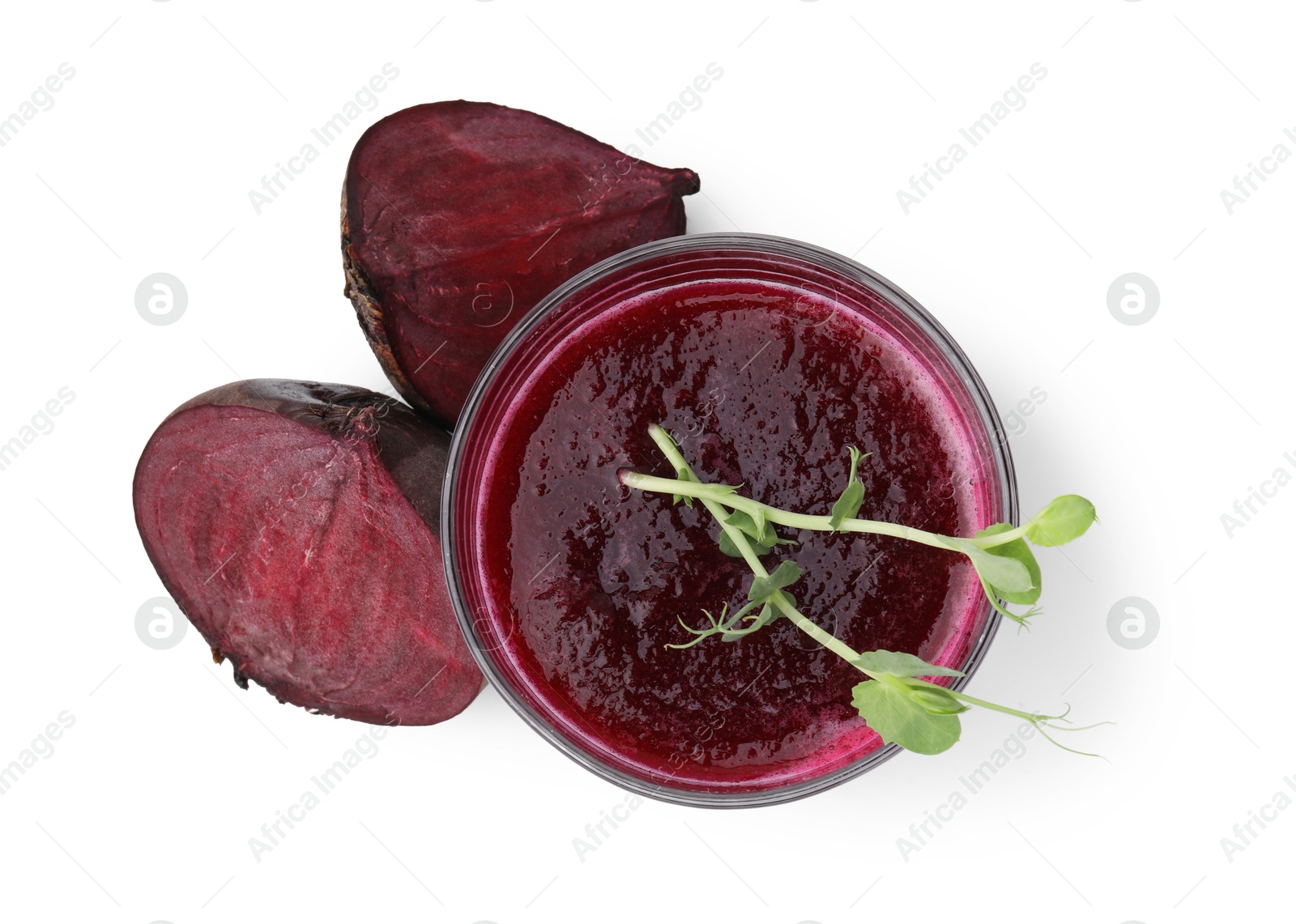 Photo of Tasty beetroot smoothie with microgreens in glass and fresh vegetables isolated on white, top view. Vegan drink