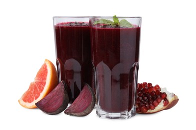 Photo of Fresh beetroot smoothie in glasses, grapefruit, beet and pomegranate isolated on white