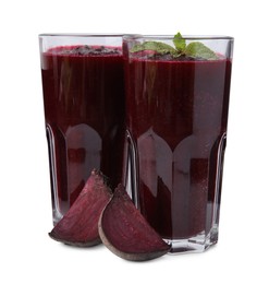 Photo of Fresh beetroot smoothie in glasses isolated on white