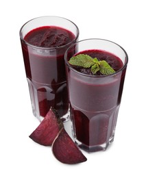 Fresh beetroot smoothie in glasses isolated on white