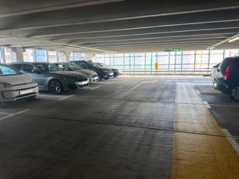 Parked cars in underground garage of apartment complex