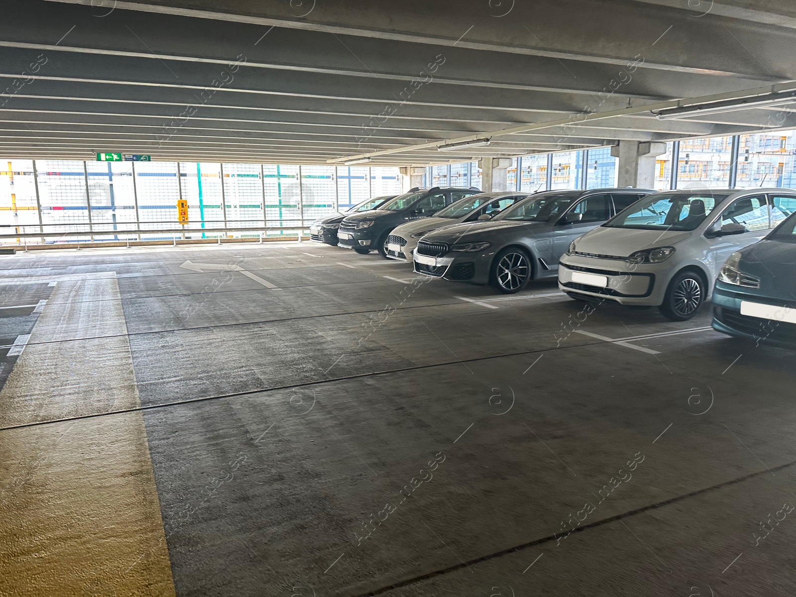 Photo of Parked cars in underground garage of apartment complex