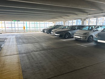 Parked cars in underground garage of apartment complex