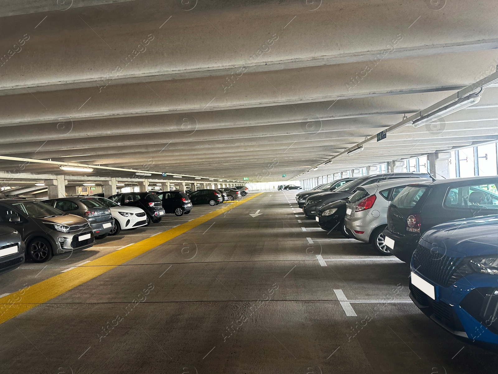 Photo of Parked cars in underground garage of apartment complex