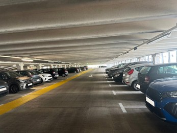 Parked cars in underground garage of apartment complex