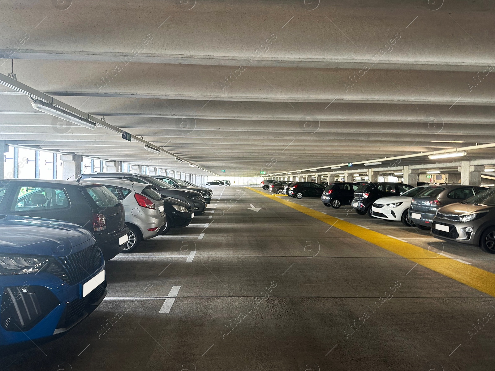 Photo of Parked cars in underground garage of apartment complex