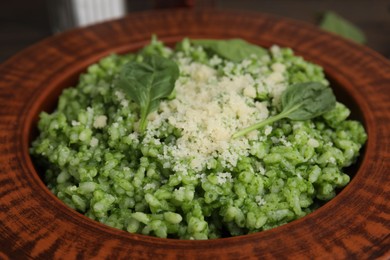 Photo of Delicious spinach risotto with parmesan cheese on table, closeup