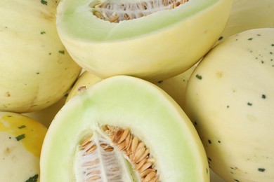 Photo of Fresh ripe honeydew melons as background, closeup