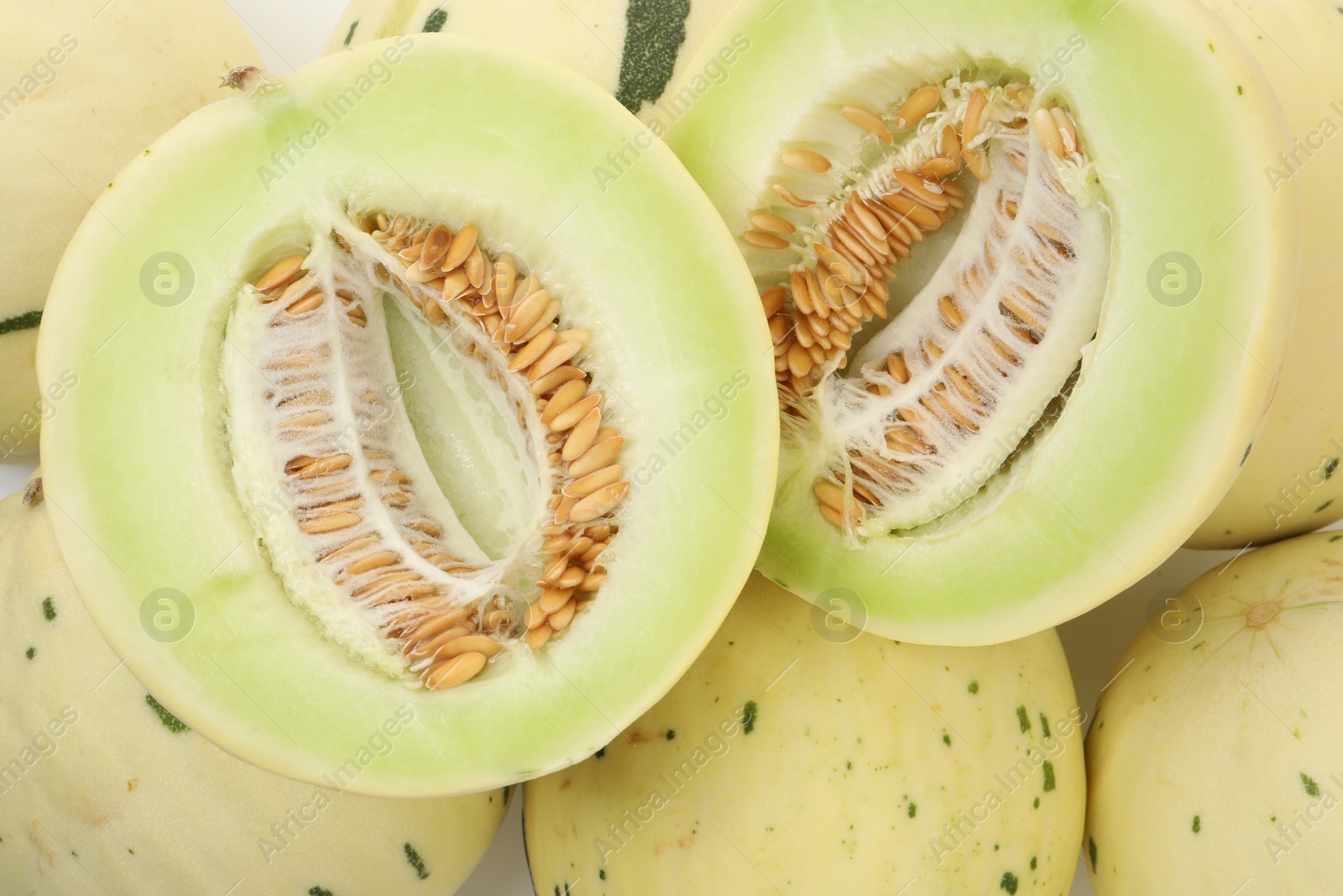 Photo of Fresh ripe honeydew melons as background, top view