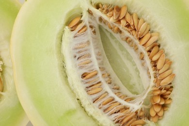 Photo of Cut fresh ripe honeydew melon as background, closeup