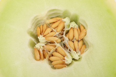 Photo of Cut fresh ripe honeydew melon as background, closeup