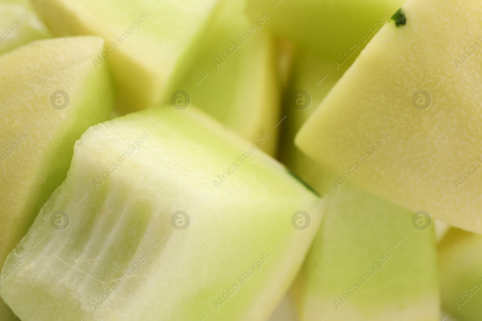 Photo of Pieces of fresh ripe honeydew melon as background, closeup