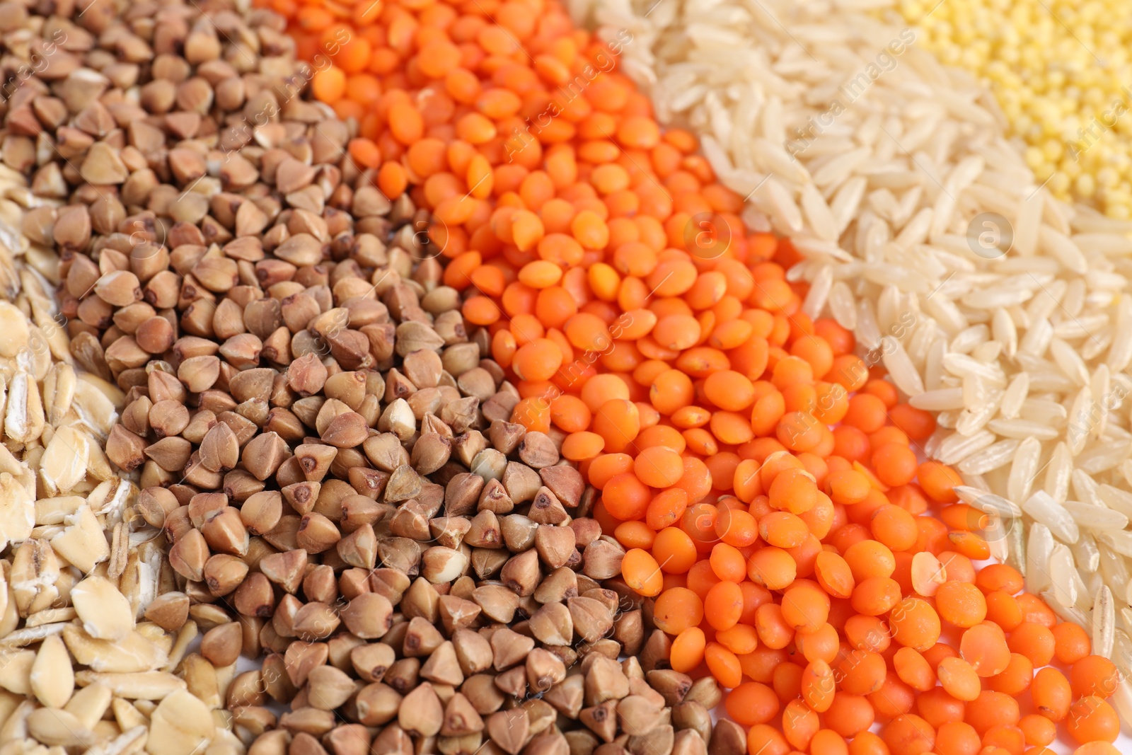 Photo of Different grains and cereals as background, closeup