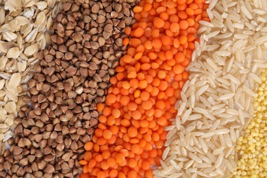 Photo of Different grains and cereals as background, top view