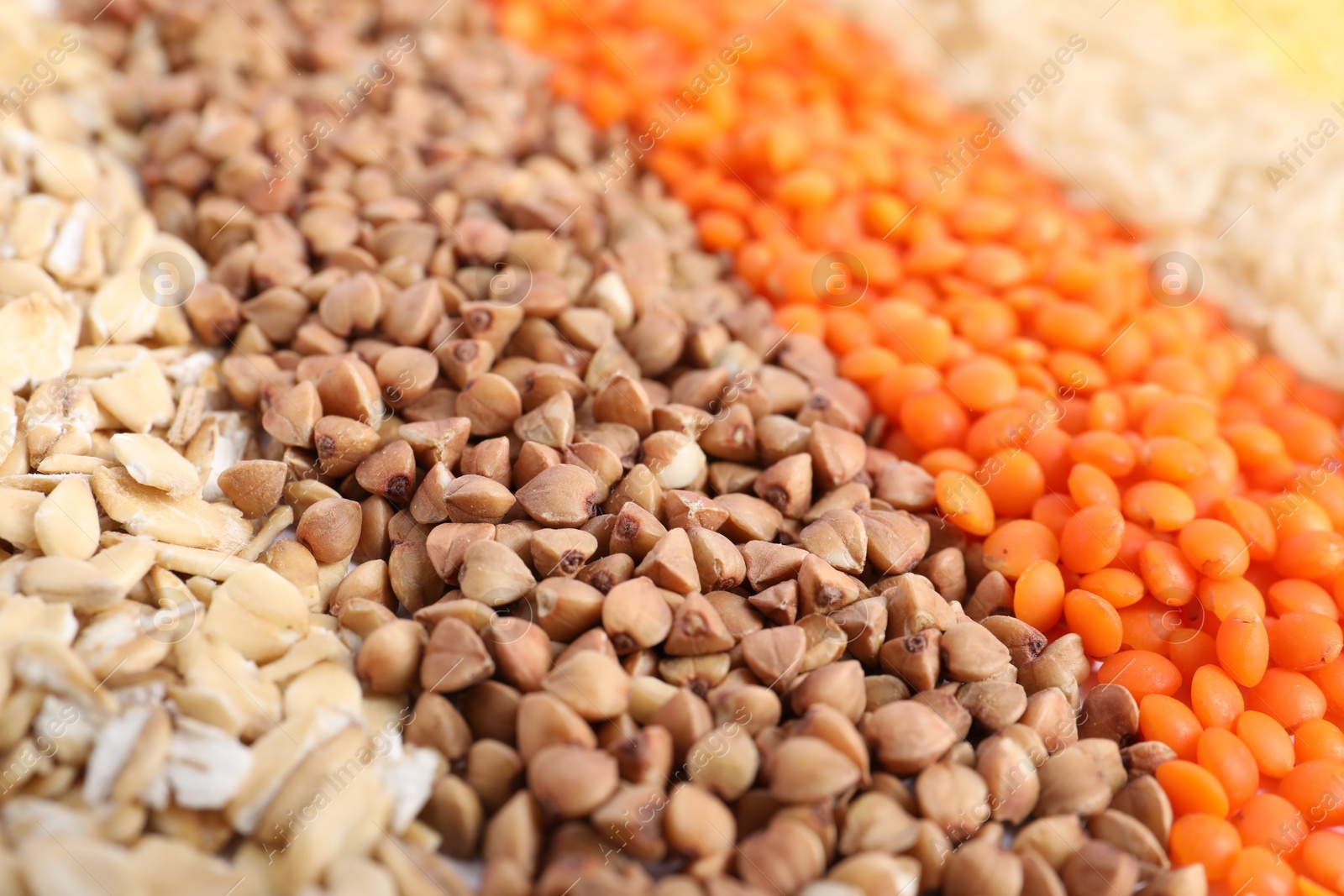 Photo of Different grains and cereals as background, closeup