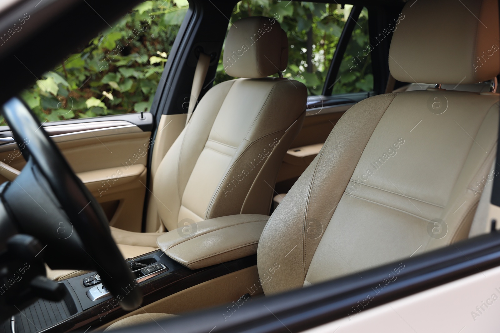 Photo of Steering wheel and leather seats inside car